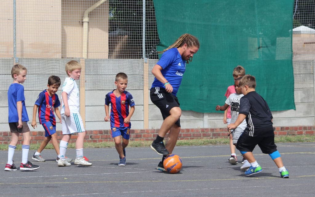 af south africa-coach demonstrating soccer skill