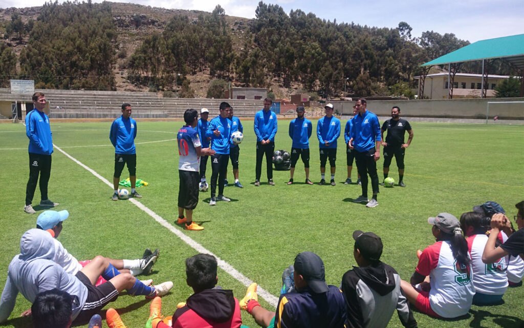 ambassadors football team huddle in bolivia