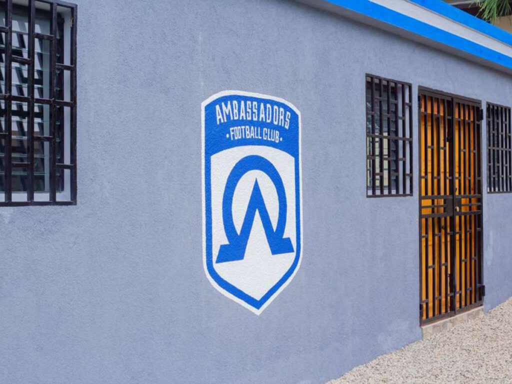 ambassadors football club logo on locker room in haiti