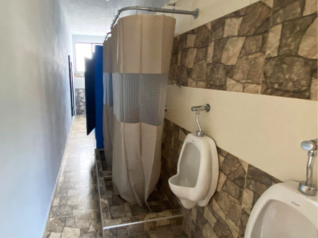 bathroom and showers in the locker room at ambassadors training centre haiti