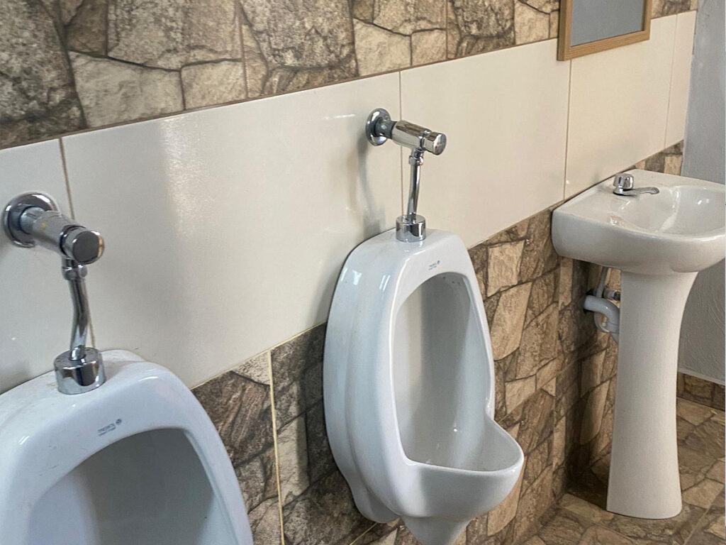 bathroom urinals and vanity at ambassadors training centre haiti