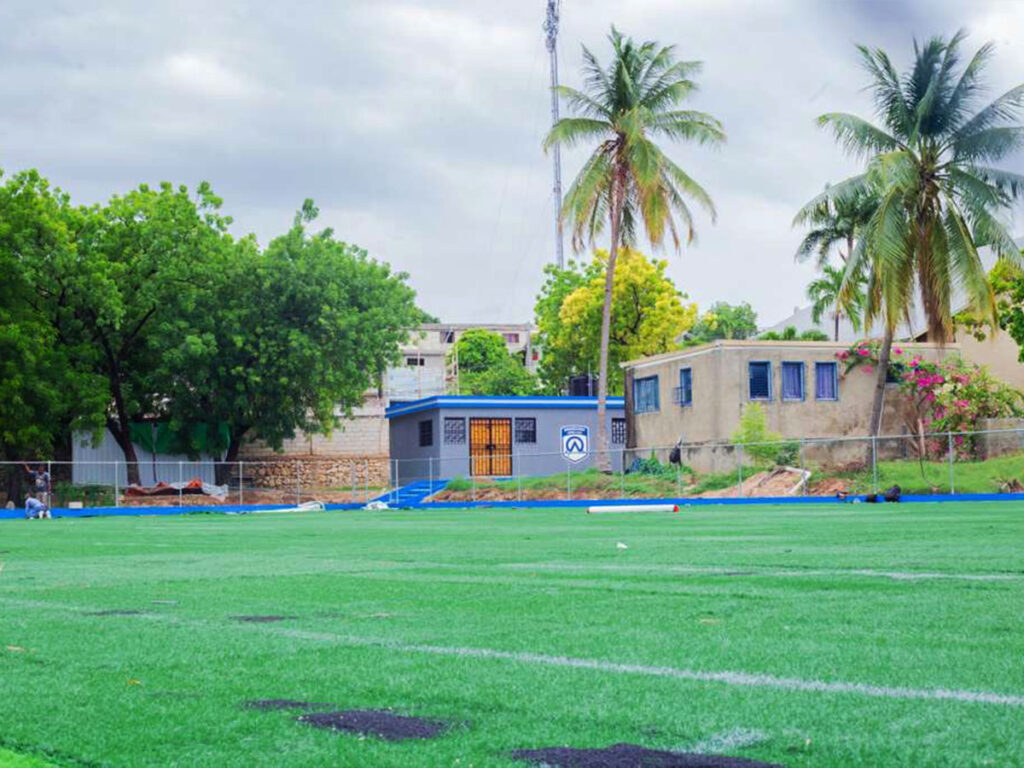 field and locker room at the ambassadors training centre in haiti